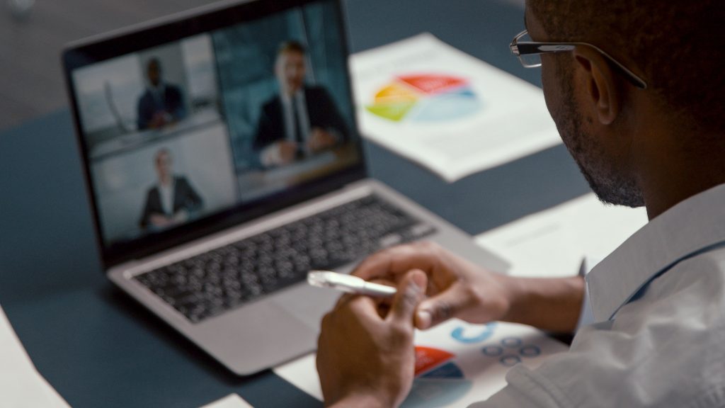 Businessman communicating on video at home