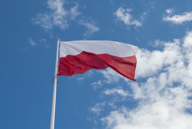 flag political poland against the background of the sky and clouds